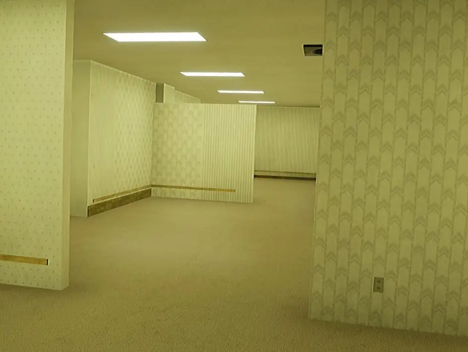 Endless yellow office hallway with fluorescent lights