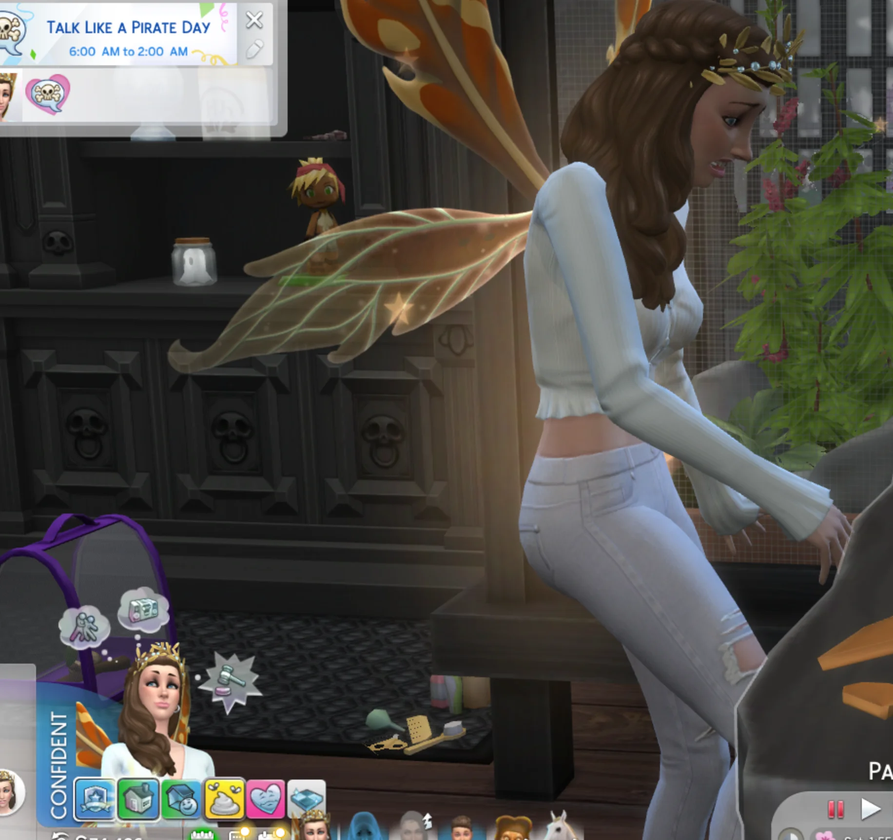 My sim wearing a white outfit, long brown hair, standing in front of a table looking extremely embarrassed. Down on the left side of the screenshot are little mood lets, one of them being an image of a piece of doodoo 