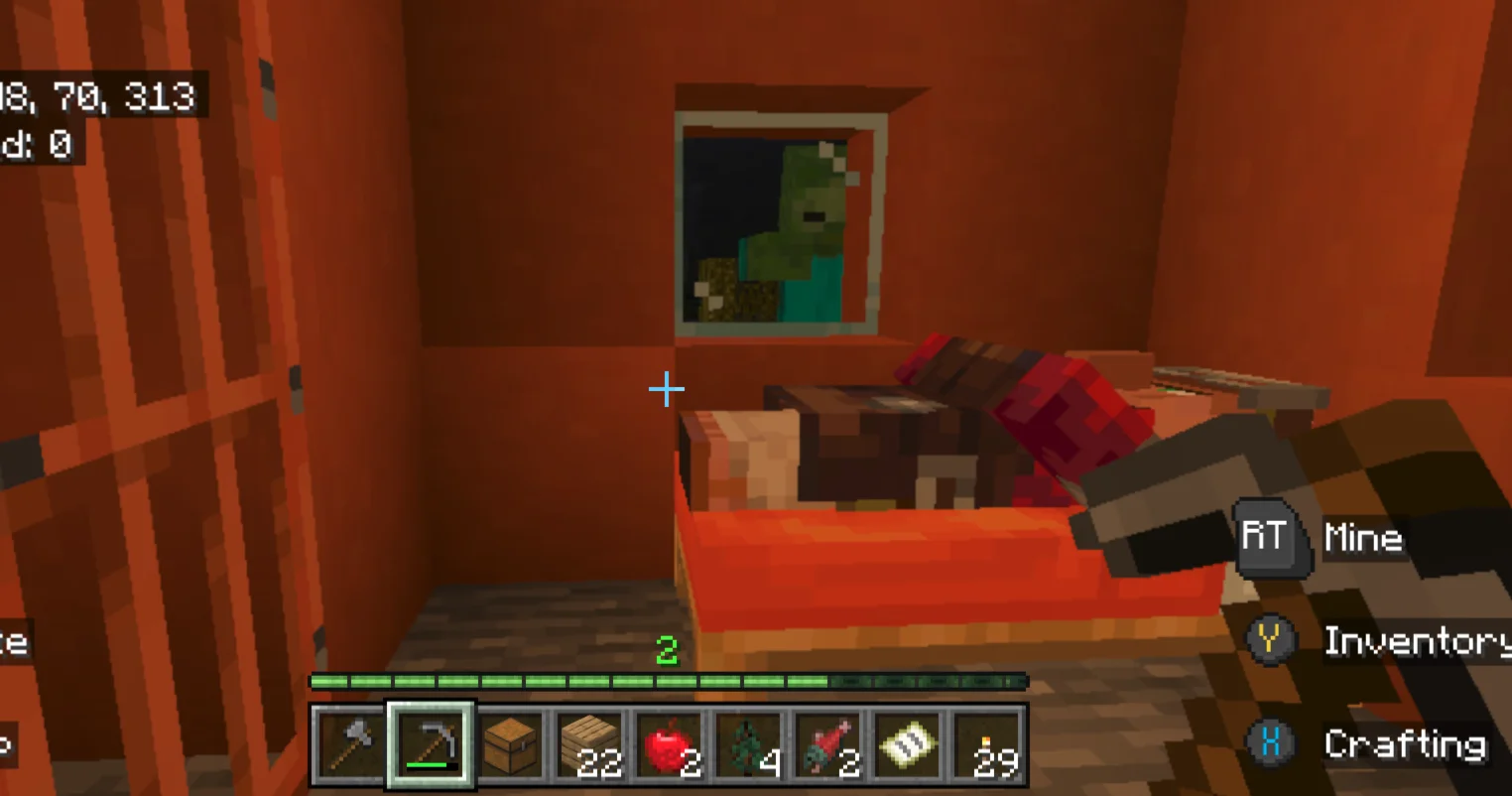 A screenshot from Minecraft, standing inside of a small orange home, where a villager NPC sleeps in his bed, while a green zombie stares in from the outside behind a window
