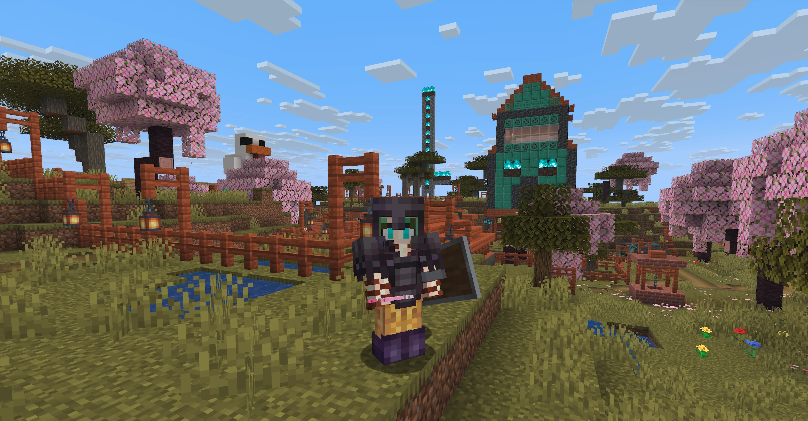 A screenshot from Minecraft on my server of a building with a huge monster's face carved into the side of it, with a pointed roof, all covered in oxidized copper. The surrounding land is grass dotted with cherry blossom trees and lightly faded grass. In the center is my character standing heavily armored